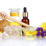 fragrant honey spa with oils and honey isolated on white