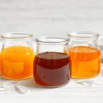 Composition with honey on white wooden background